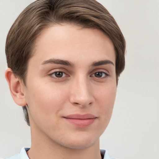 Joyful white young-adult female with short  brown hair and grey eyes