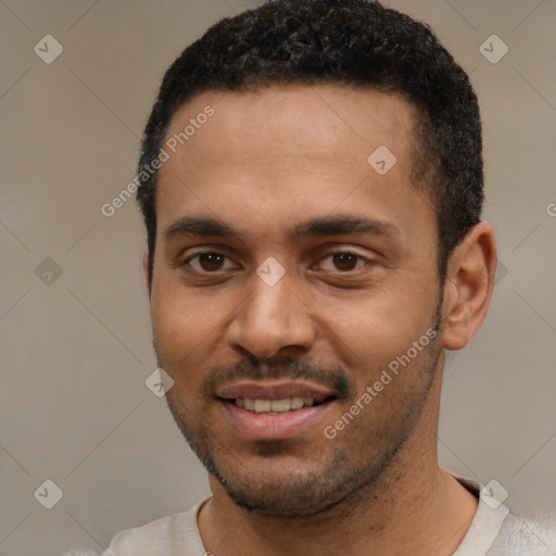 Joyful white young-adult male with short  black hair and brown eyes