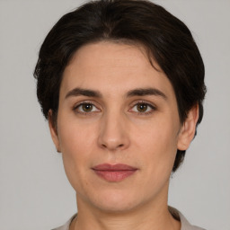 Joyful white adult female with short  brown hair and brown eyes