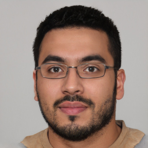 Neutral latino young-adult male with short  black hair and brown eyes
