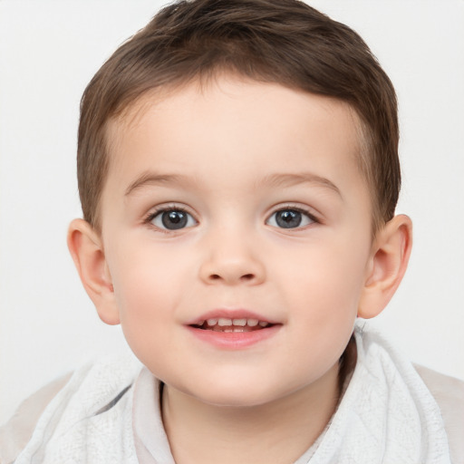 Joyful white child male with short  brown hair and brown eyes