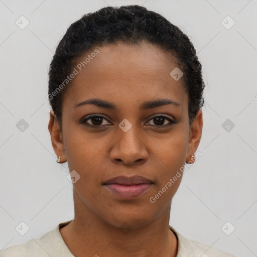 Joyful black young-adult female with short  black hair and brown eyes