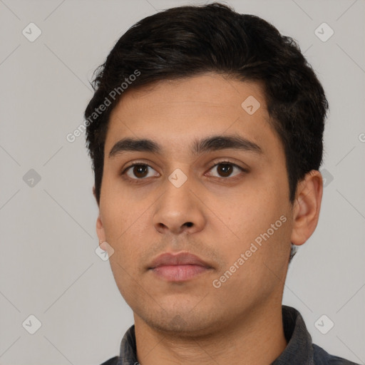 Neutral latino young-adult male with short  black hair and brown eyes