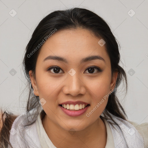 Joyful latino young-adult female with medium  brown hair and brown eyes