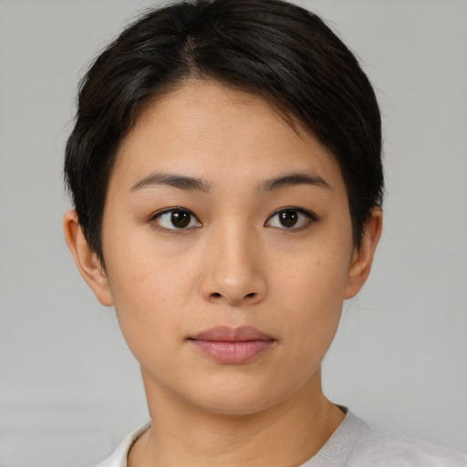 Neutral asian young-adult female with medium  brown hair and brown eyes