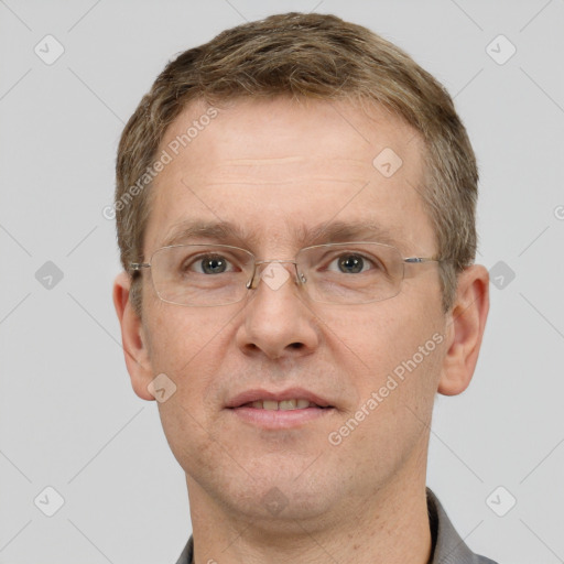 Joyful white adult male with short  brown hair and grey eyes