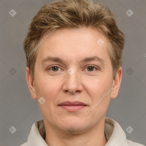 Joyful white adult female with short  brown hair and grey eyes