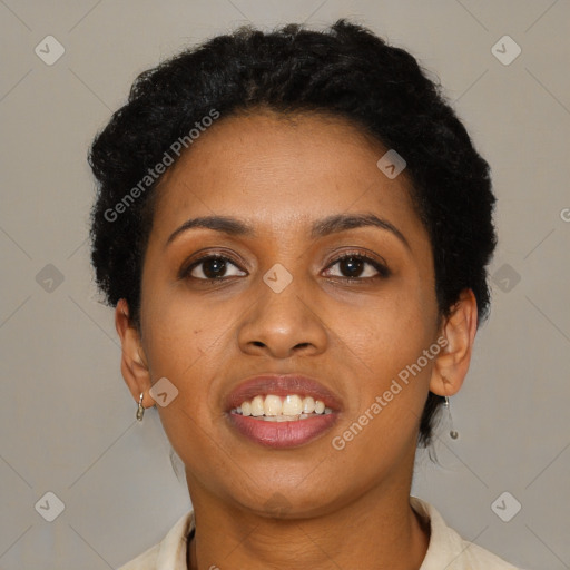 Joyful black young-adult female with short  black hair and brown eyes