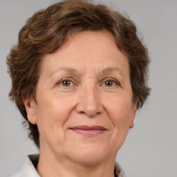 Joyful white middle-aged female with short  brown hair and brown eyes