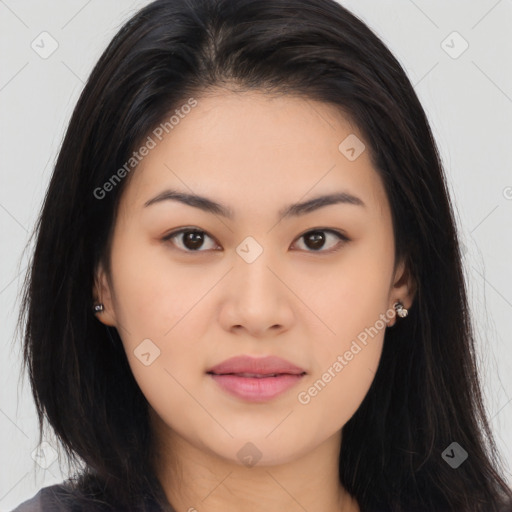 Joyful asian young-adult female with long  brown hair and brown eyes