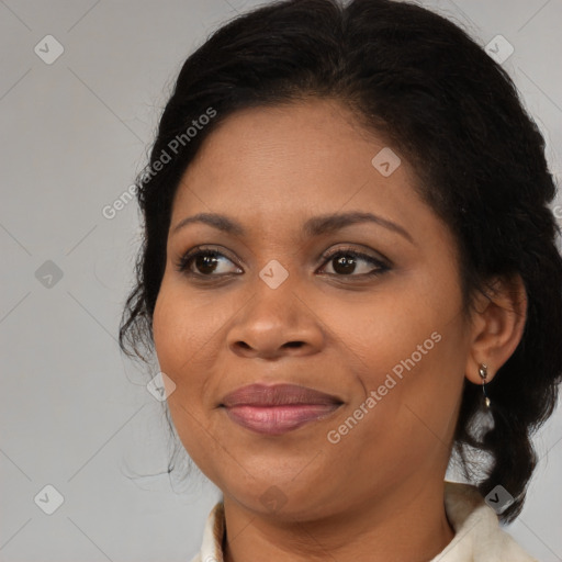 Joyful black adult female with medium  brown hair and brown eyes