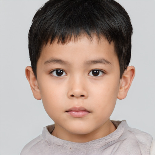 Neutral asian child male with short  brown hair and brown eyes