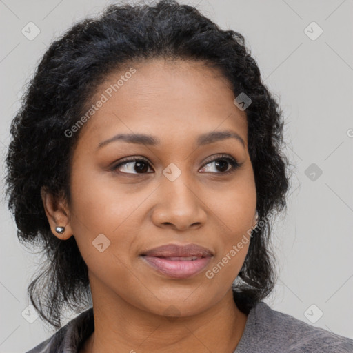 Joyful black young-adult female with medium  brown hair and brown eyes