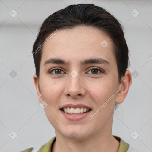 Joyful white young-adult female with short  brown hair and grey eyes