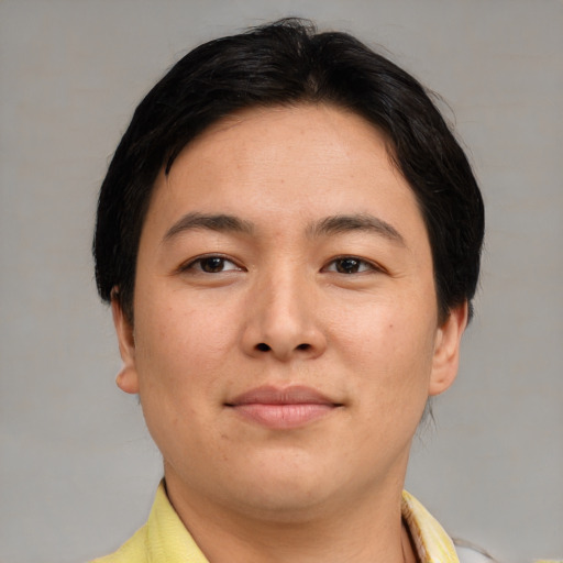 Joyful asian young-adult female with short  brown hair and brown eyes
