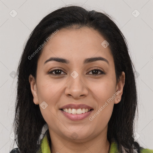 Joyful latino young-adult female with medium  brown hair and brown eyes