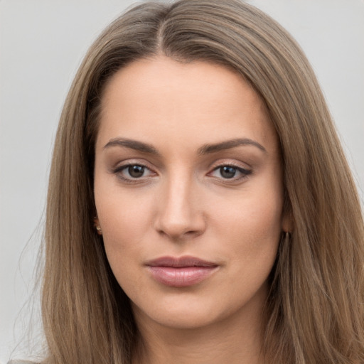 Neutral white young-adult female with long  brown hair and brown eyes