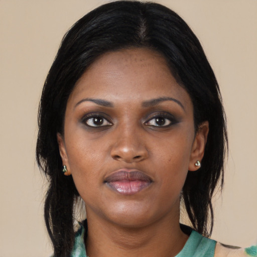 Neutral black young-adult female with medium  black hair and brown eyes