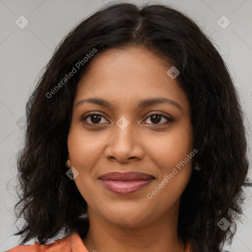 Joyful black young-adult female with medium  brown hair and brown eyes