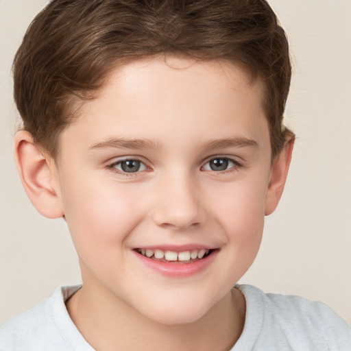 Joyful white child male with short  brown hair and brown eyes