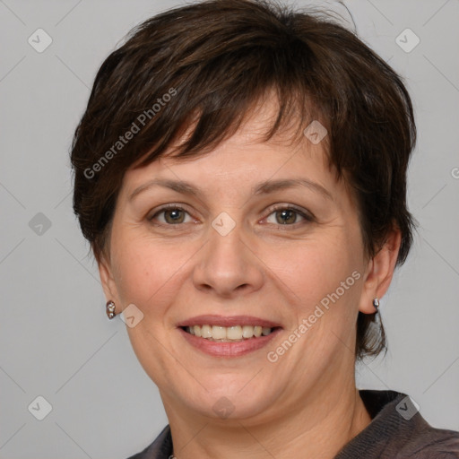 Joyful white adult female with medium  brown hair and grey eyes