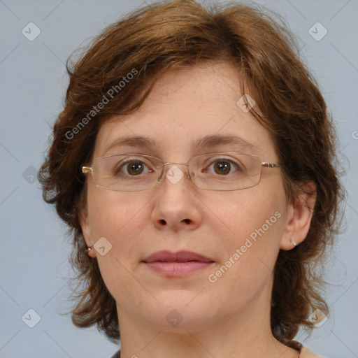 Joyful white adult female with medium  brown hair and blue eyes