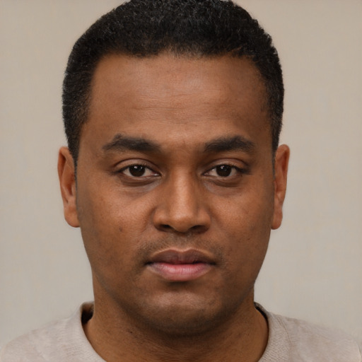 Neutral black young-adult male with short  brown hair and brown eyes