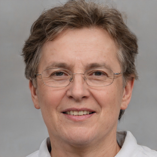 Joyful white middle-aged female with short  brown hair and grey eyes