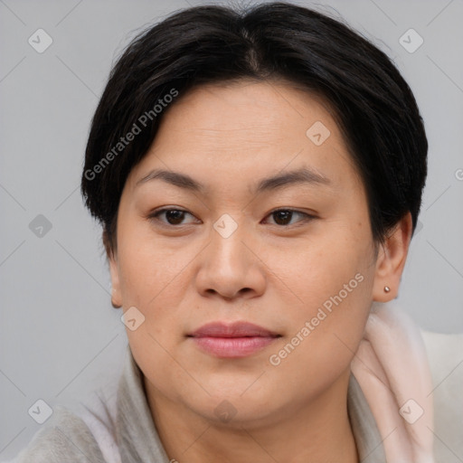 Joyful asian young-adult female with short  brown hair and brown eyes