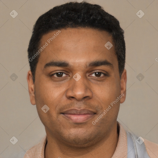 Joyful black young-adult male with short  black hair and brown eyes