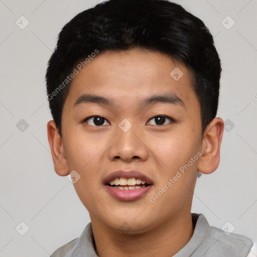 Joyful asian young-adult male with short  brown hair and brown eyes
