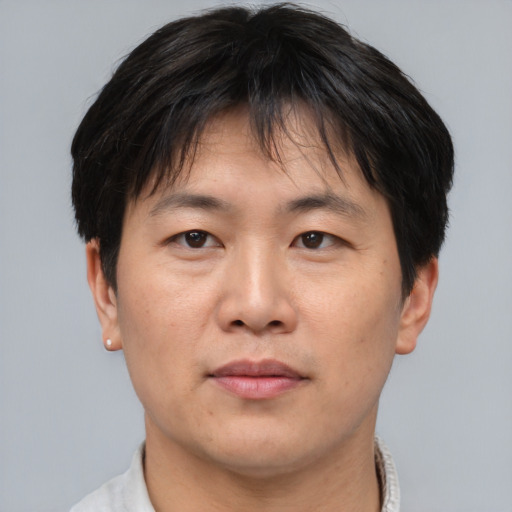 Neutral asian adult male with short  brown hair and brown eyes