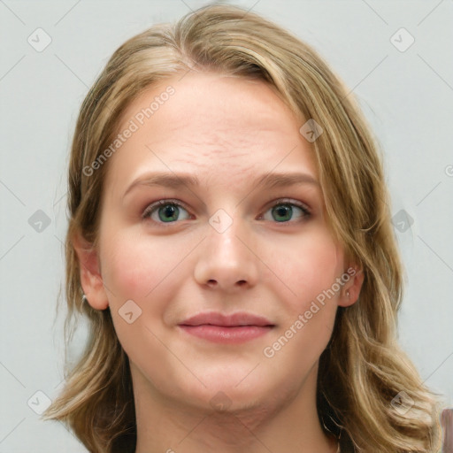 Joyful white young-adult female with long  brown hair and blue eyes