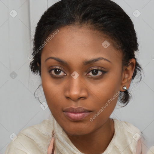 Joyful black young-adult female with long  brown hair and brown eyes