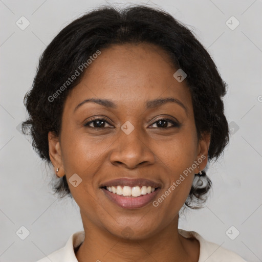 Joyful black adult female with medium  brown hair and brown eyes