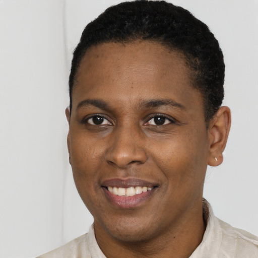Joyful latino young-adult female with short  black hair and brown eyes