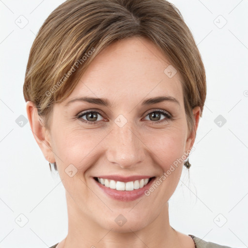 Joyful white young-adult female with short  brown hair and grey eyes