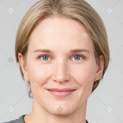 Joyful white young-adult female with medium  brown hair and grey eyes