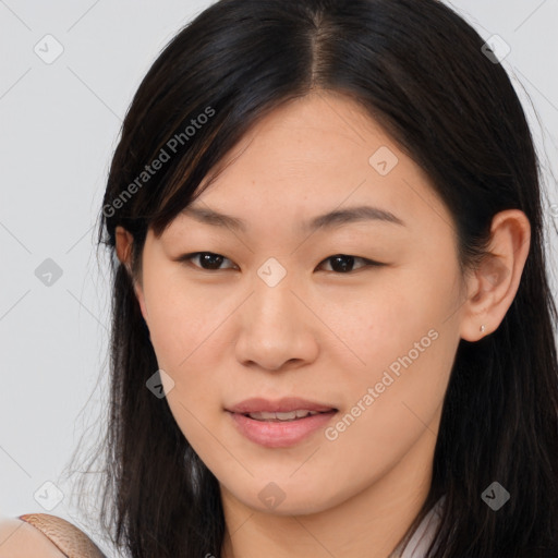 Joyful asian young-adult female with long  brown hair and brown eyes