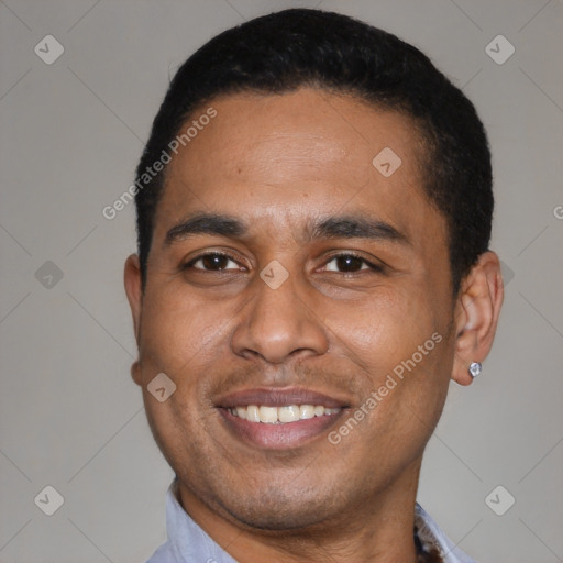 Joyful latino young-adult male with short  black hair and brown eyes