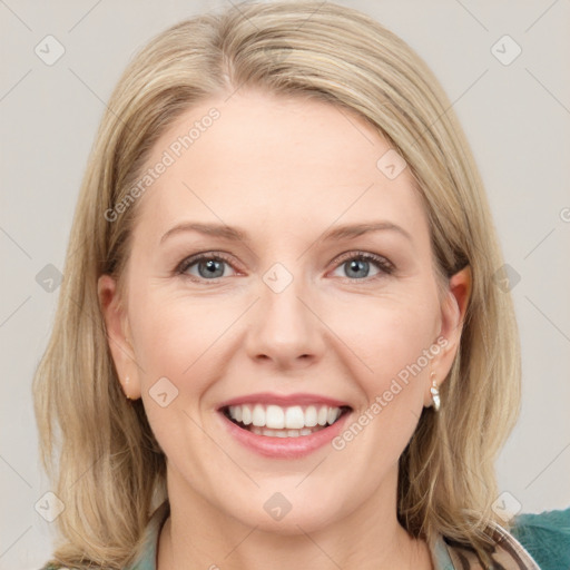 Joyful white young-adult female with medium  brown hair and blue eyes