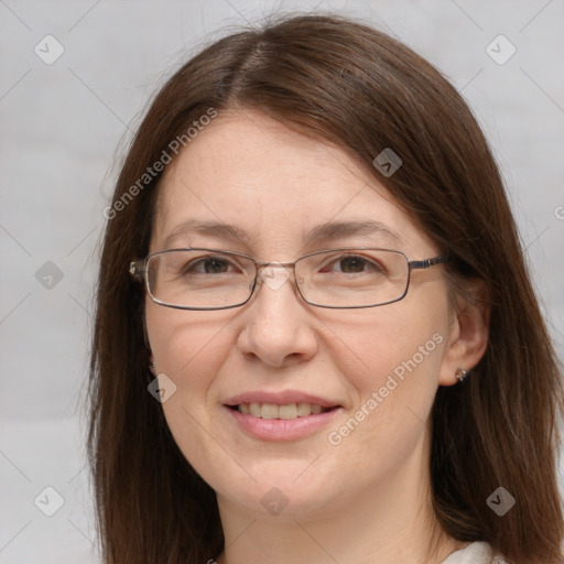 Joyful white adult female with medium  brown hair and grey eyes