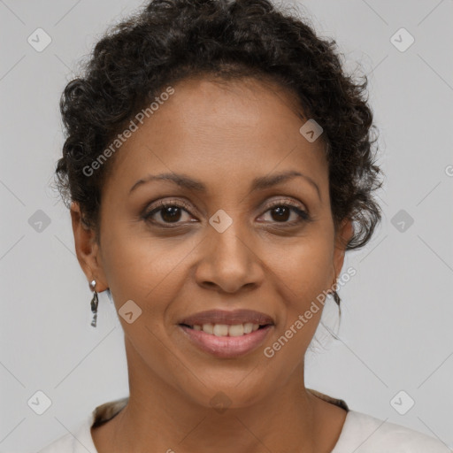 Joyful latino adult female with short  brown hair and brown eyes