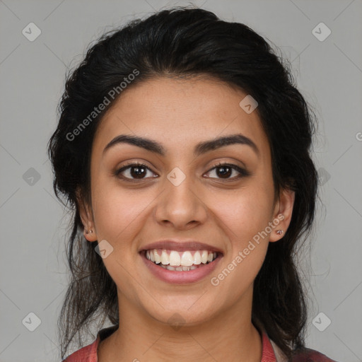 Joyful latino young-adult female with medium  brown hair and brown eyes