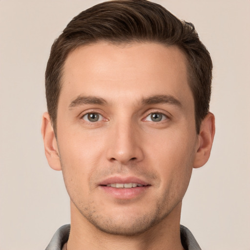 Joyful white young-adult male with short  brown hair and brown eyes