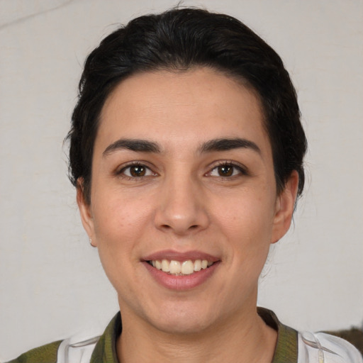 Joyful white young-adult female with medium  brown hair and brown eyes