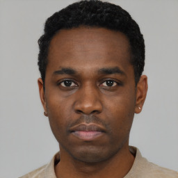 Neutral black young-adult male with short  black hair and brown eyes