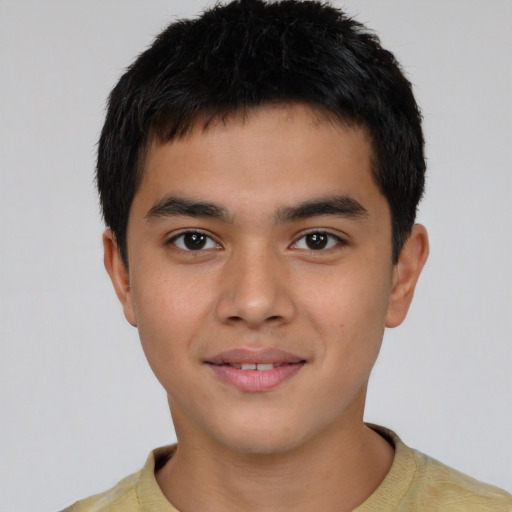 Joyful asian child male with short  brown hair and brown eyes