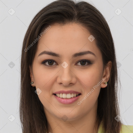 Joyful latino young-adult female with long  brown hair and brown eyes