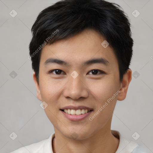 Joyful asian young-adult male with short  brown hair and brown eyes